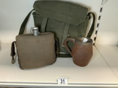 A ROYAL AIR FORCE CARVED WOODEN TANKARD, AN ARMY WATER BOTTLE, A CANVAS SHOULDER BAG, A MESS TIN