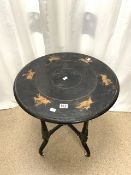 ANTIQUE EBONISED ROUND TABLE WITH CARVED FIGURES ON HORSEBACK TO THE TOP 59CM DIAMETER