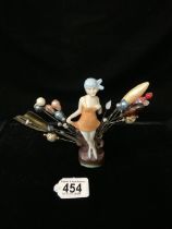 CERAMIC ART DECO FIGURE WITH A COLLECTION OF HAT PINS
