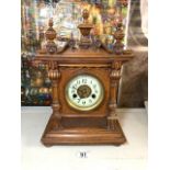 VICTORIAN OAK CASED MANTEL CLOCK WITH STRIKING MOVEMENT AND CIRCULAR ENAMEL DIAL, 39CMS.