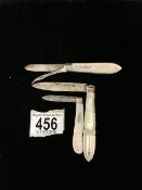 THREE HALLMARKED SILVER WITH ENGRAVED MOTHER OF PEARL FOLDING FRUIT KNIVES , ONE WITH DOUBLE BLADE