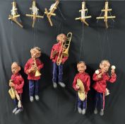 BANDSMEN, SAXOPHONIST, TROMBONIST, TRUMPETER, CYMBALIST AND MARIONETTE PLAYING MARACAS; 54CM. CAN BE