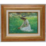 A framed oil on canvas of a lady picking flowers, 18 x 24cm