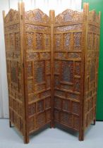 An oriental pierced and hinged four panel wooden screen, each panel 183.5 x 50 x 2cm