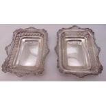 A pair of Victorian hallmarked silver pierced rectangular bonbon dishes, London 1896 by William