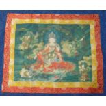 A Tibetan silk tanka rectangular with a deity amidst clouds, 92 x 112cm