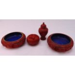 A pair of cinnabar lacquer dishes, a circular covered box and an urn and cover (4)