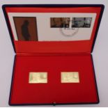 A cased set of two 18ct gold Churchill replica stamps dated Nov 1965 first edition