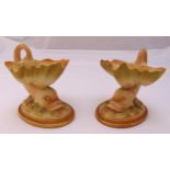 A pair of Royal Worcester dolphin shell dishes on raised oval bases, marks to the bases 11cm (h)