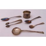 A quantity of hallmarked silver to include spoons, a napkin ring and a pair of tongs (6)