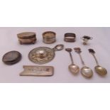 A quantity of hallmarked silver to include a strainer, napkin rings, teaspoons, an oval jewellery
