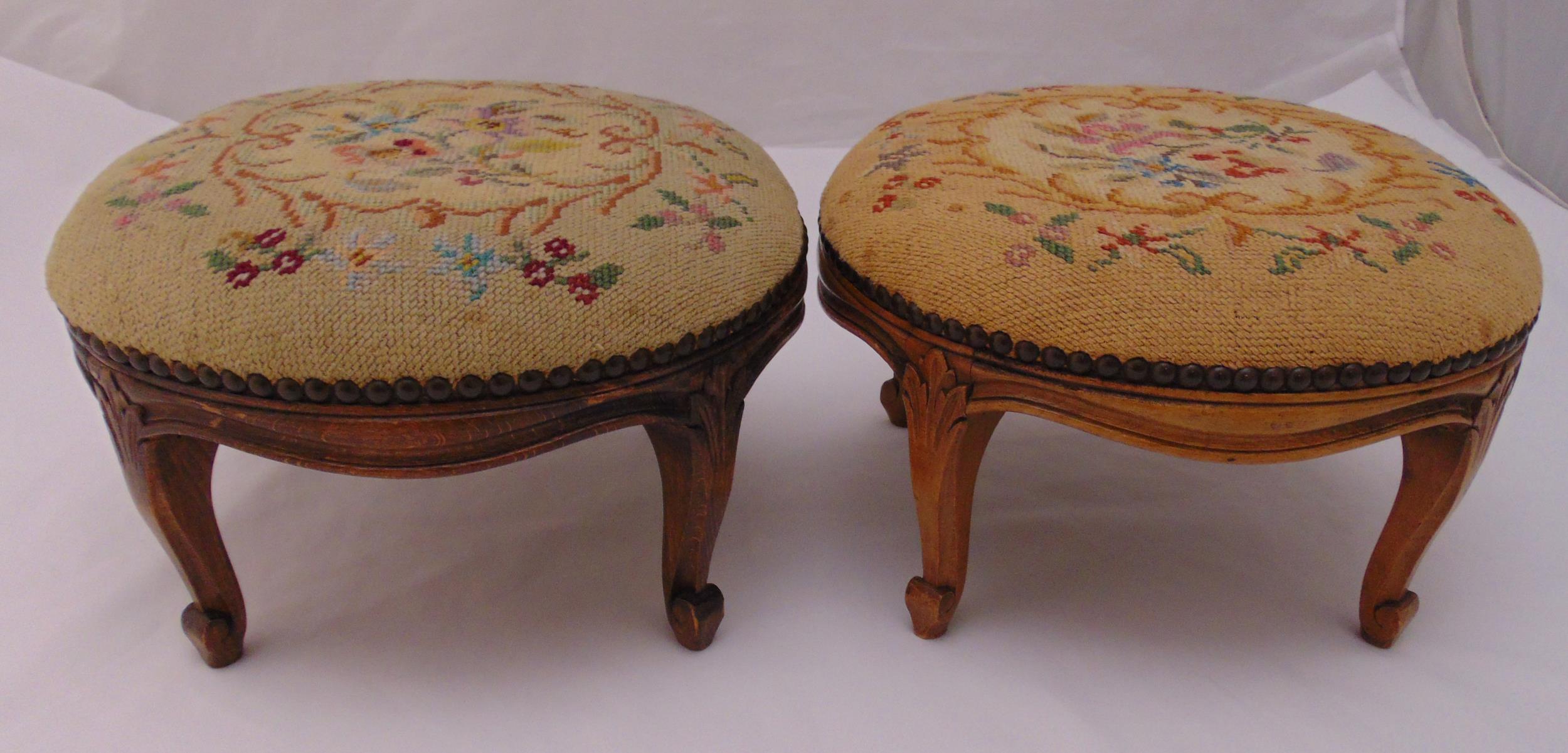 A pair of circular mahogany upholstered foot stools, 21 x 33cm each