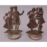 Two hallmarked silver place card holders of courting couples on raised circular base, Birmingham