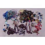 A quantity of costume jewellery to include necklaces, bracelets and brooches