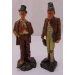 Two continental ceramic figurines of gentlemen of the road on naturalistic bases, 40cm (h)