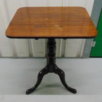 A mid 19th century mahogany tilt top occasional table, rounded rectangular, on banded cylindrical