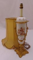 A Sevres style porcelain and gilt metal table lamp decorated with putti and flowers, to include