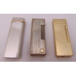 Three cigarette lighters to include Cartier, Dunhill and Colibri