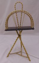 A brass magazine rack of simulated bamboo form with carrying handle, 70 x 35 x 30cm