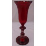 A Victorian ruby glass vase of tulip form on knopped stem and raised circular base, 47.5 cm (h)