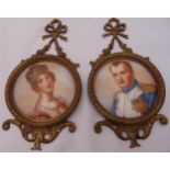 A pair of gilded metal wall plaques with images of Napoleon and Josephine, 20 x 10cm