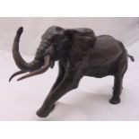 Osborne limited edition bronze figurine of a charging elephant, signed to the base, 12 x 26cm