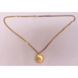 9ct gold pendant on a 9ct gold fancy link chain, approx total weight 22.2g