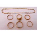 A quantity of gold jewellery to include six rings and a necklace, gold tested 14ct, approx total