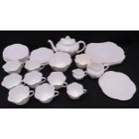A Shelley white porcelain tea set to include a teapot, milk and cream jugs, bowls, plates, cups