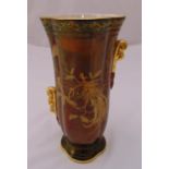 A Crown Devon vase, fluted oval form on raised base with gilded decoration, mark to the base, 27.5cm