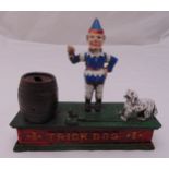 A novelty Trick Dog money box, the cast figures on raised rectangular base, A/F, 18.5 x 20.5 x 7cm