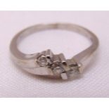9ct white gold three stone diamond crossover ring, approx total weight 2.1g