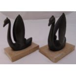 A pair of cast metal stylised Swan bookends mounted on rectangular stone bases, 15.5cm (h) each
