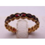 14ct yellow gold and garnet eternity ring, approx total weight 2.1g