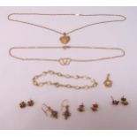 A quantity of 9ct gold jewellery to include four pairs of earrings, a bracelet, a locket on a chain,