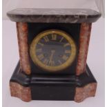 A slate mantle clock, rectangular architectural form, black dial with gilded Roman numerals, 22.