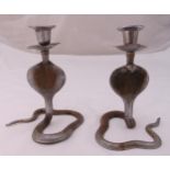 A pair of silver plated Middle Eastern candlesticks in the form of cobras, 17cm (h)