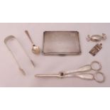 A quantity of hallmarked silver and white metal to include a pair of grape scissors, an engine