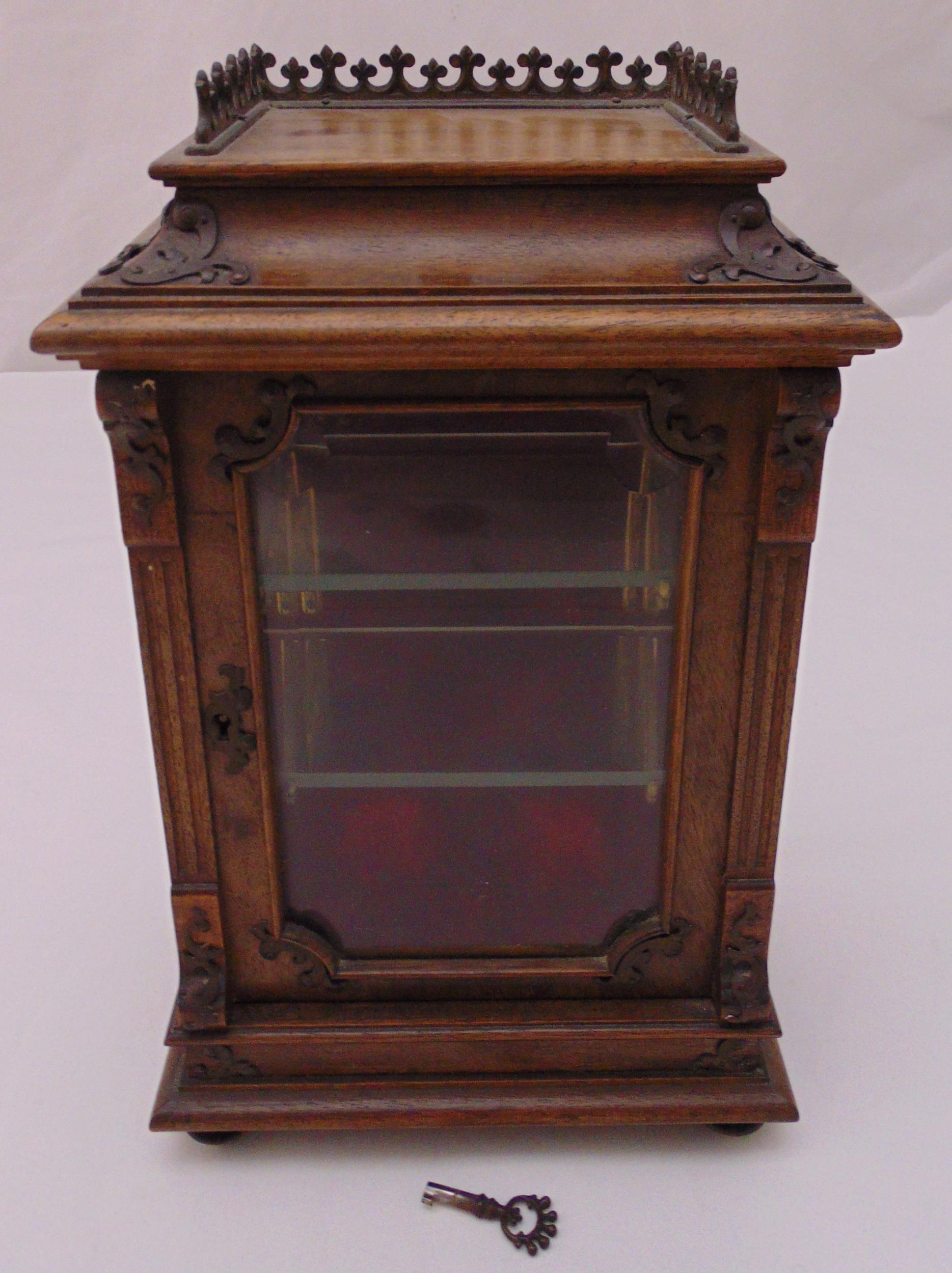 A rectangular mahogany miniature glazed display cabinet to include key, 33cm (h)