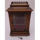 A rectangular mahogany miniature glazed display cabinet to include key, 33cm (h)