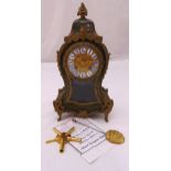 An 1880 green Boule mantle clock, gilded dial with enamel Roman numerals, two train movement to