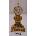 A continental eight day single train movement mantle clock of tapering rectangular form, hand