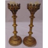 A pair of Victorian ecclesiastical brass candlesticks, cylindrical knopped form on raised circular