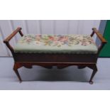 A late Victorian mahogany rectangular bench, hinged tapestry top, two side handles inlaid with