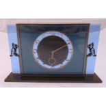 An Art Deco brass and glass rectangular eight day mantle clock, Arabic numerals with cast metal