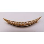 A Victorian 15ct gold crescent brooch set with graduated pearls, approx total weight 4.7g