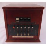 An early 20th century private telephone exchange in rectangular mahogany case, 30 x 29 x 25cm