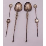 A pair of hallmarked silver anointing spoons and four matching smaller anointing spoons, approx