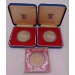 Two 1977 silver crowns in fitted packaging and QEII Silver Jubilee souvenir medal