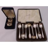 A quantity of hallmarked silver to include a pair of cased napkin rings, two condiment spoons and